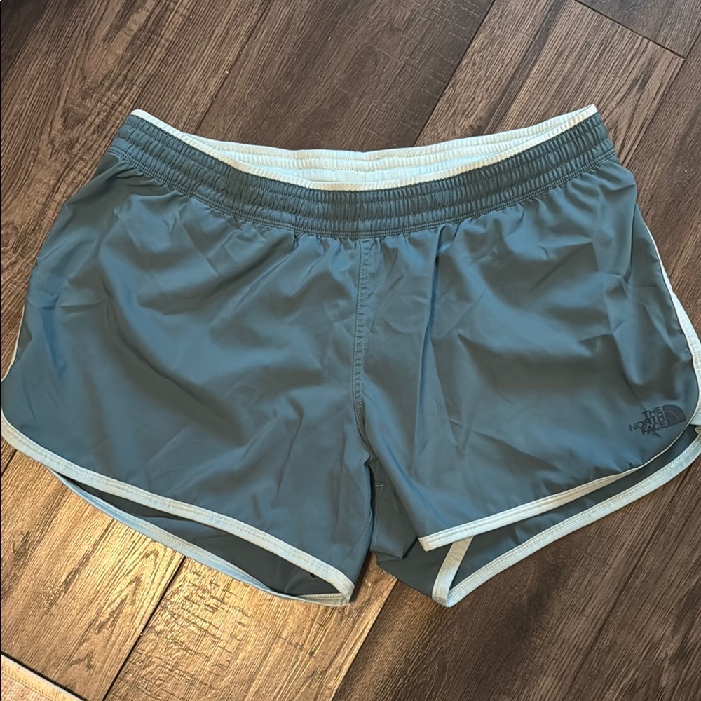 The North Face Blue trail running Shorts with Curved Hems